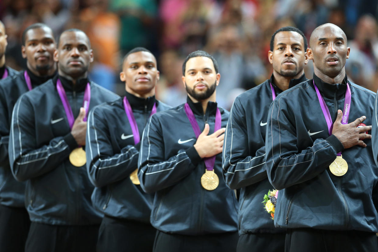 The USA's Kobe Bryant and teammates during the national anthem at the Men's Basketball Final between USA and Spain at the North Greenwich Arena during the London 2012 Olympic games. London, UK. 12th August 2012. (Photo: Steve Christo) (Photo by Steve  Christo/Corbis via Getty Images)