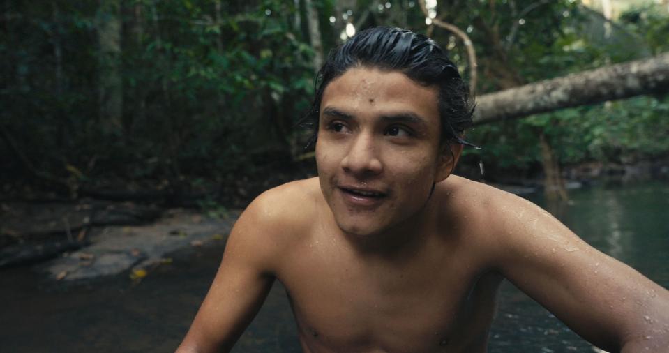 Bitatè, the young leader of the Indigenous Uru-eu-wau-wau, swims in a river near his village in the Amazon rainforest.<span class="copyright">Alex Pritz—Amazon Land Documentary</span>