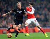 <p>Arsenal’s Hector Bellerin and Hull City’s Kamil Grosicki (left) </p>