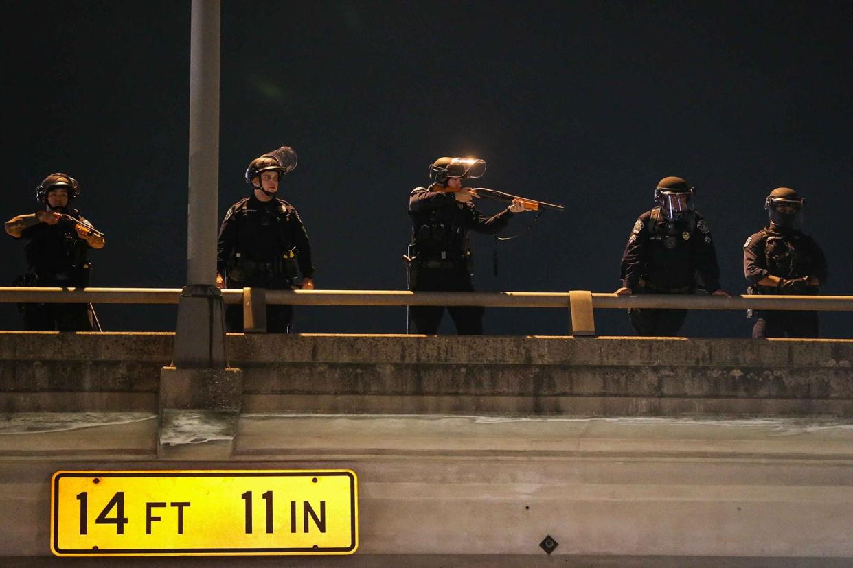 Austin police fire "less-lethal" rounds at protesters in Austin on May 31, 2020.