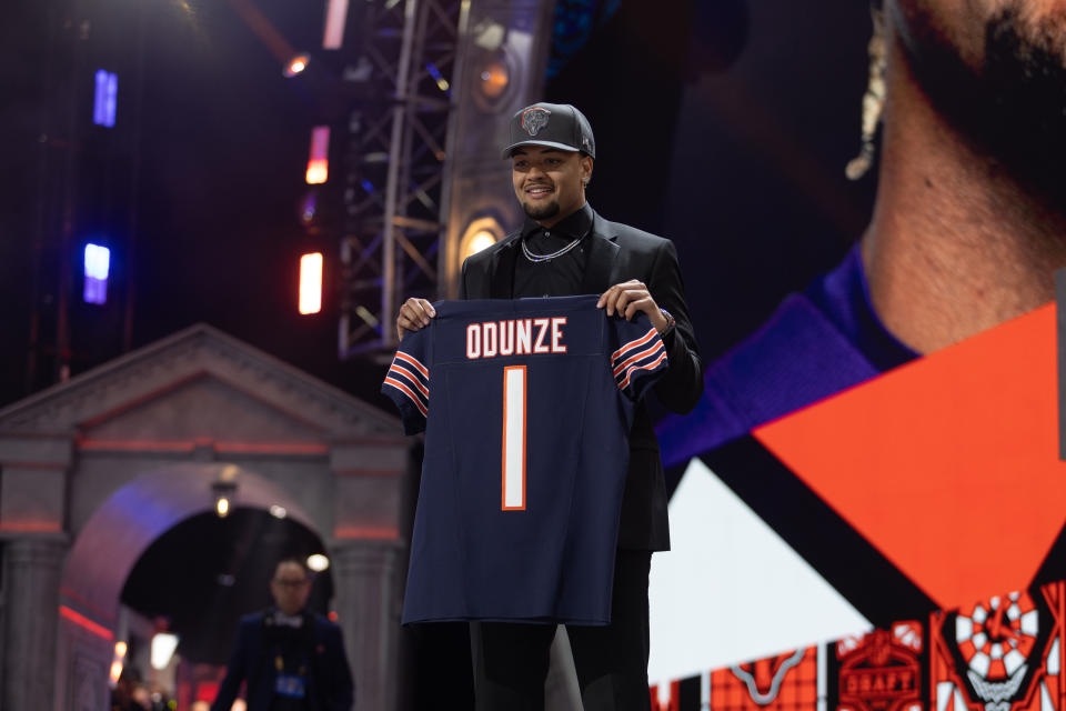 DETROIT, MI - APRIL 25: Washington Wide Receiver Rome Odunze holds a jersey on stage after being taken ninth overall by the Chicago Bears during Day 1 of the NFL Draft on April 25, 2024 at Campus Martius Park and Hart Plaza in Detroit, MI. (Photo by John Smolek/Icon Sportswire via Getty Images)