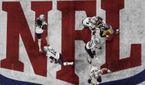 <p>New England Patriots’ Tom Brady (12) hands the ball off to Rex Burkhead against the Los Angeles Rams during the first half of the NFL Super Bowl 53 football game Sunday, Feb. 3, 2019, in Atlanta. (AP Photo/Morry Gash) </p>