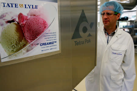 FILE PHOTO: A technician uses an ice cream machine at the Tate & Lyle European Innovation Centre in Villeneuve d'Ascq, France, September 26, 2018. REUTERS/Pascal Rossignol/File Photo