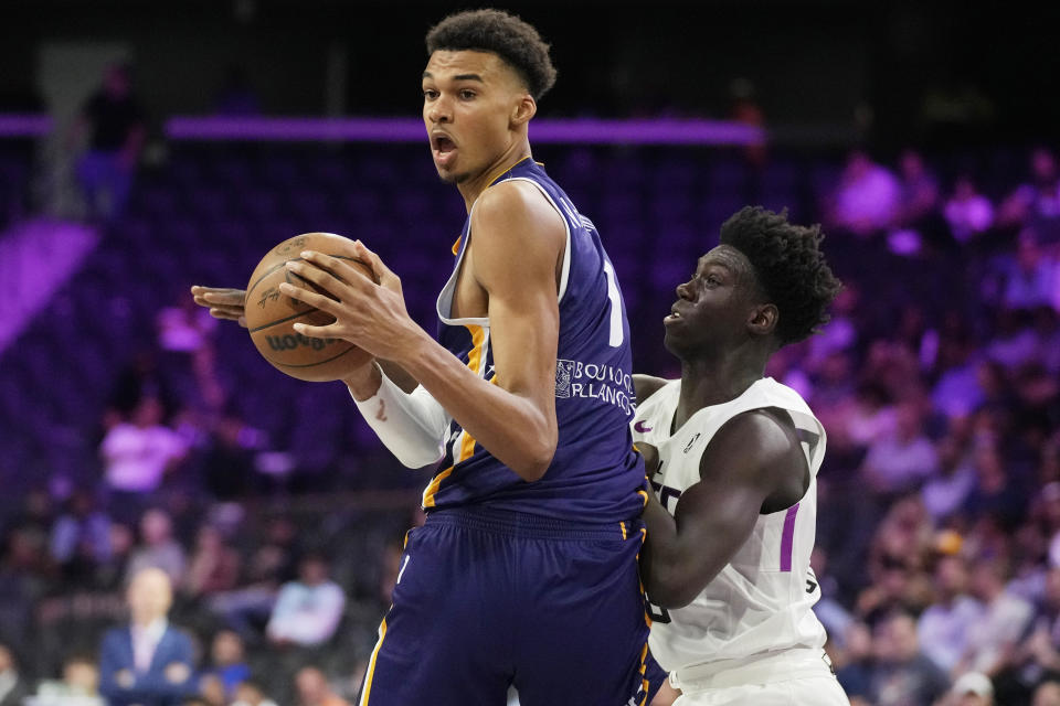 Boulogne-Levallois Metropolitans 92's Victor Wembanyama drives around NBA G League Ignite's Sidy Cissoko during the second half of an exhibition basketball game Tuesday, Oct. 4, 2022, in Henderson, Nev. (AP Photo/John Locher)