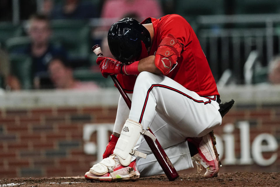 Atlanta Braves' Vaughn Grissom takes a moment after fouling a ball off his foot in the fifth inning of a baseball game against the Houston Astros Friday, Aug. 19, 2022, in Atlanta. Grissom remained in the game. (AP Photo/John Bazemore)