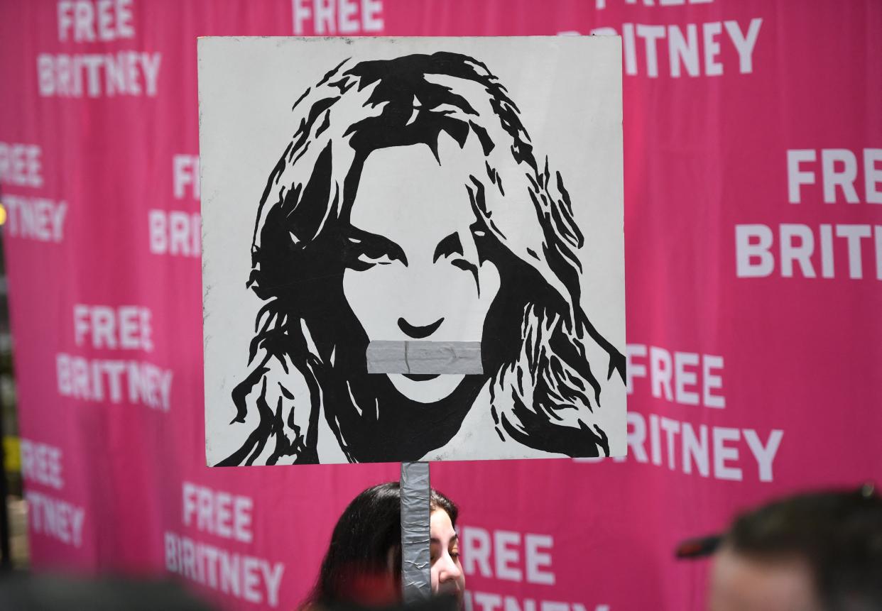 Poster of Britney Spears with her mouth taped shut outside the Los Angeles County Courthouse on July 14, 2021.