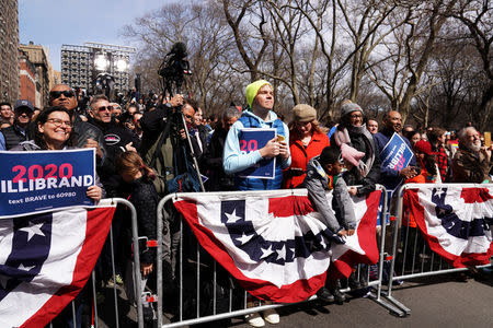 People watch Democratic 2020 U.S. presidential candidate and U.S. Senator Kirsten Gillibrand (D-NY) speak during her campaign kick off event in New York, New York, U.S., March 24, 2019. REUTERS/Carlo Allegri