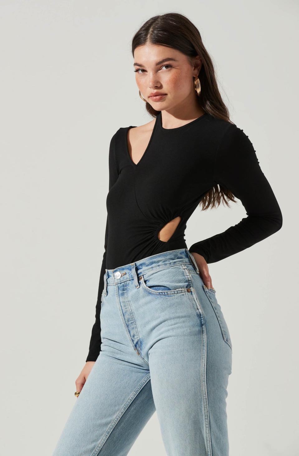 <p><a href="https://www.astrthelabel.com/collections/whats-new/products/long-sleeve-asymmetrical-cutout-bodysuit?color=BLACK" rel="nofollow noopener" target="_blank" data-ylk="slk:Shop Now;elm:context_link;itc:0;sec:content-canvas" class="link ">Shop Now</a></p> <p>astrthelabel.com</p>