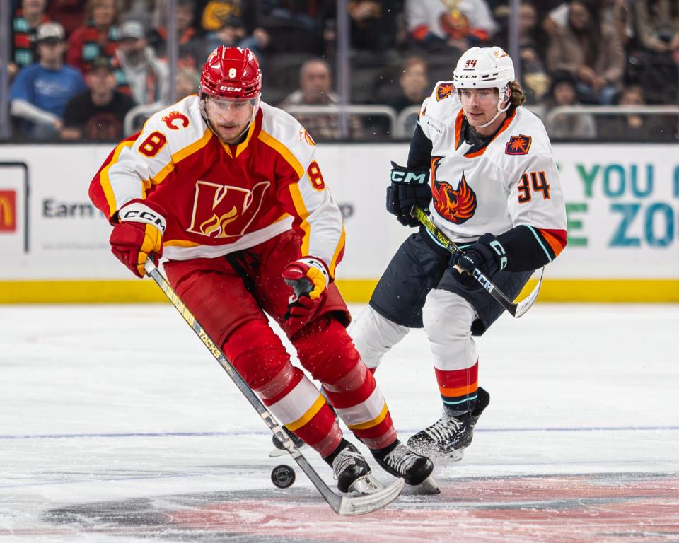 Marian Studenic (34) and Ilya Solovyov (8) skate down the ice with the puck at Acrisure Arena in Thousand Palms, CA, on November 11, 2023.