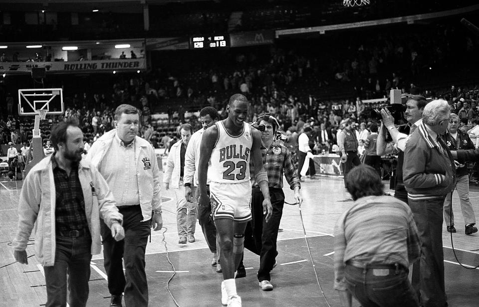 CHICAGO - JANUARY 1988:  Chicago Bulls guard Michael Jordan walks off the court after a victory against the New Jersey Nets at Chicago Stadium in Chicago, Illinois in January 1988.  (Photo By Raymond Boyd/Getty Images)