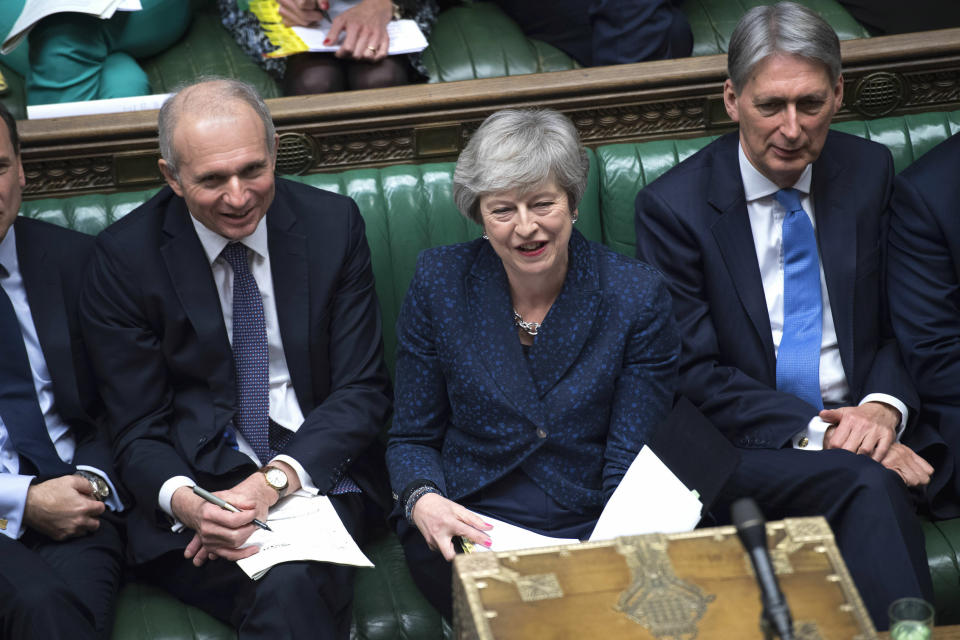 Britain's Cabinet Office Minister David Lidington, Prime Minister Theresa May and Chancellor Philip Hammond sit during Prime Minister's Questions in the House of Commons, London, Wednesday, Jan. 23, 2019. (©UK Parliament /Jessica Taylor via AP)