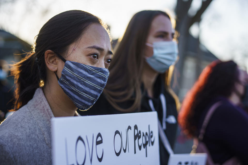 FILE - In this March 18, 2021, file photo, Madison Chau and her friend Britta Bittner gathered with others at Levin Park in Minneapolis, in solidarity with the six Asian women who were killed in a shooting Tuesday in Atlanta. Chau says she has experienced racism because of COVID-19. (Richard Tsong-Taatarii/Star Tribune via AP, File)