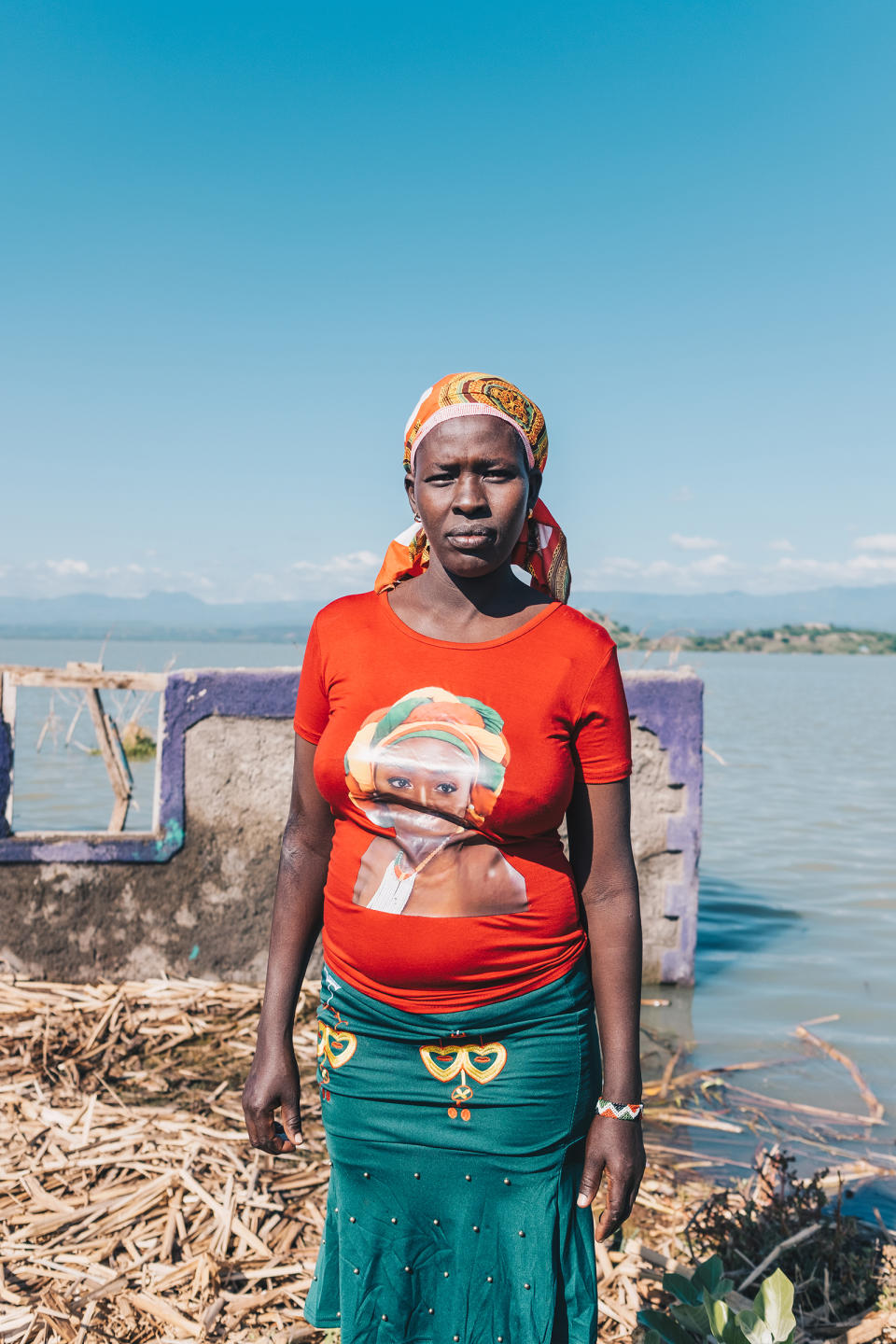 Judy Lewiri stands next to her former home on Ol Kokwe, an island within Lake Baringo. She was forced to move to higher ground and rebuild on borrowed land.<span class="copyright">Khadija M. Farah for TIME</span>