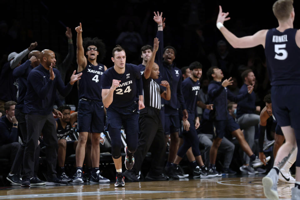 Xavier's Jack Nunge (24) clenches his fist after making a 3-point basket against Virginia Tech during the second half of an NCAA college basketball game in the NIT Season Tip-Off tournament Friday, Nov. 26, 2021, in New York. Xavier won 59-58. (AP Photo/Adam Hunger)