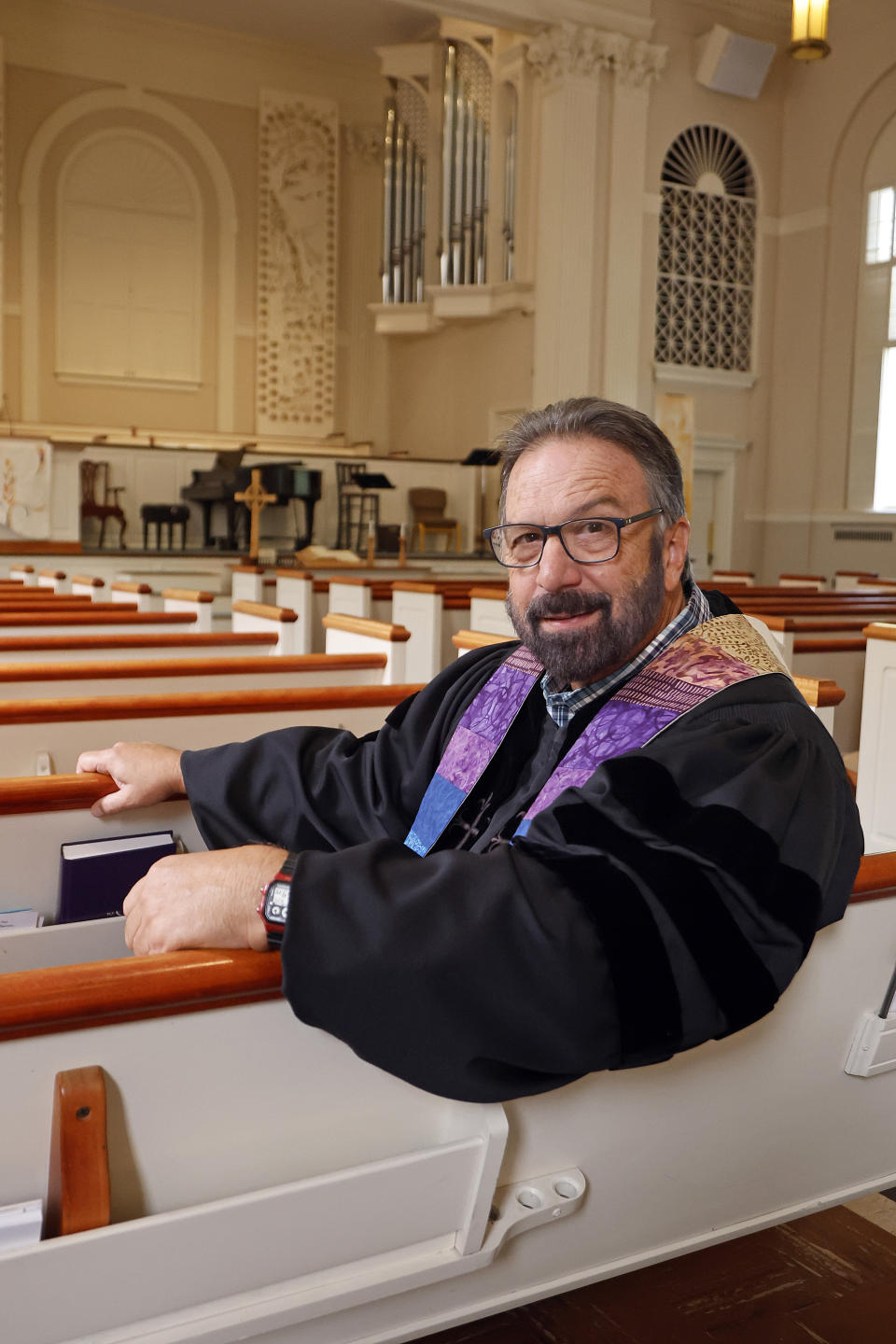 Pastor Mike Usey poses for a portrait sitting in the pews of College Park Baptist Church in Greensboro, N.C., Sunday, Sept. 25, 2022. (AP Photo/Karl DeBlaker)