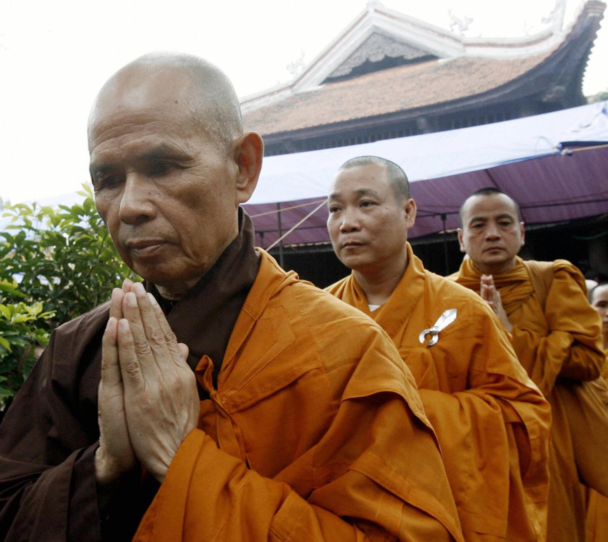 Thich Nhat Hanh (front) prays during a three-day requiem for the souls of Vietnam War victims held April 20, 2007, at a pagoda in Soc Son district, suburban Hanoi. 