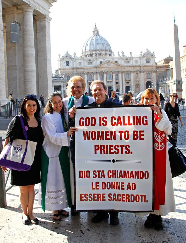 FILE PHOTO: Father Roy Bougeois from Georgia poses with a group of Roman Catholic activist in front of the Vatican