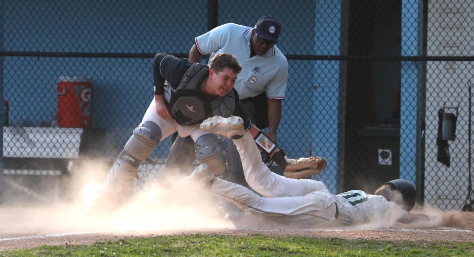 Rye Neck catcher Zach Strzalkowski tags out Pleasantville's Declan Bruder during a game at Rye Neck April 27, 2024. The game was suspended because of lightning.