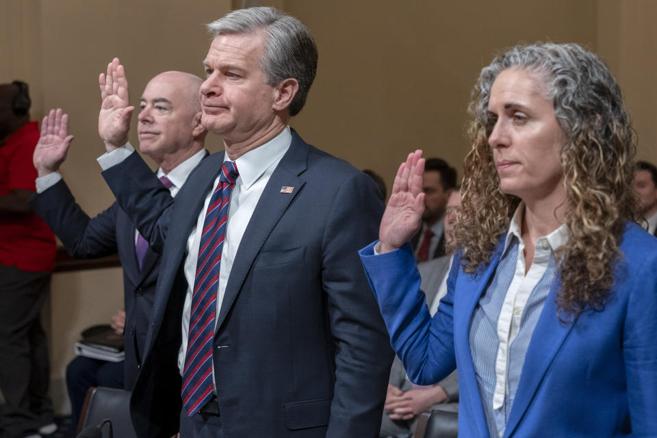 Homeland Security Secretary Alejandro Mayorkas, left, FBI Director Christopher Wray, and Christine Abizaid, Director of the National Counterterrorism Center, are sworn in during a House Committee on Homeland Security hearing on worldwide threats to the United States, Wednesday, Nov. 15, 2023, on Capitol Hill in Washington. (AP Photo/Jacquelyn Martin)