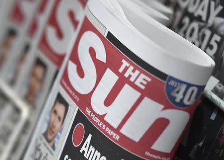 Copies of The Sun newspaper are seen on a newsstand outside a shop in central London January 20, 2015. REUTERS/Toby Melville