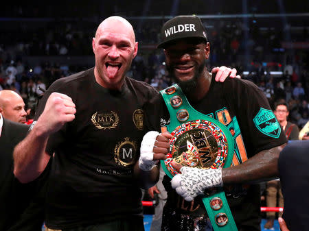 FILE PHOTO: Boxing - Deontay Wilder v Tyson Fury - WBC World Heavyweight Title - Staples Centre, Los Angeles, United States - December 1, 2018 Deontay Wilder and Tyson Fury after the fight Action Images via Reuters/Andrew Couldridge/File Photo