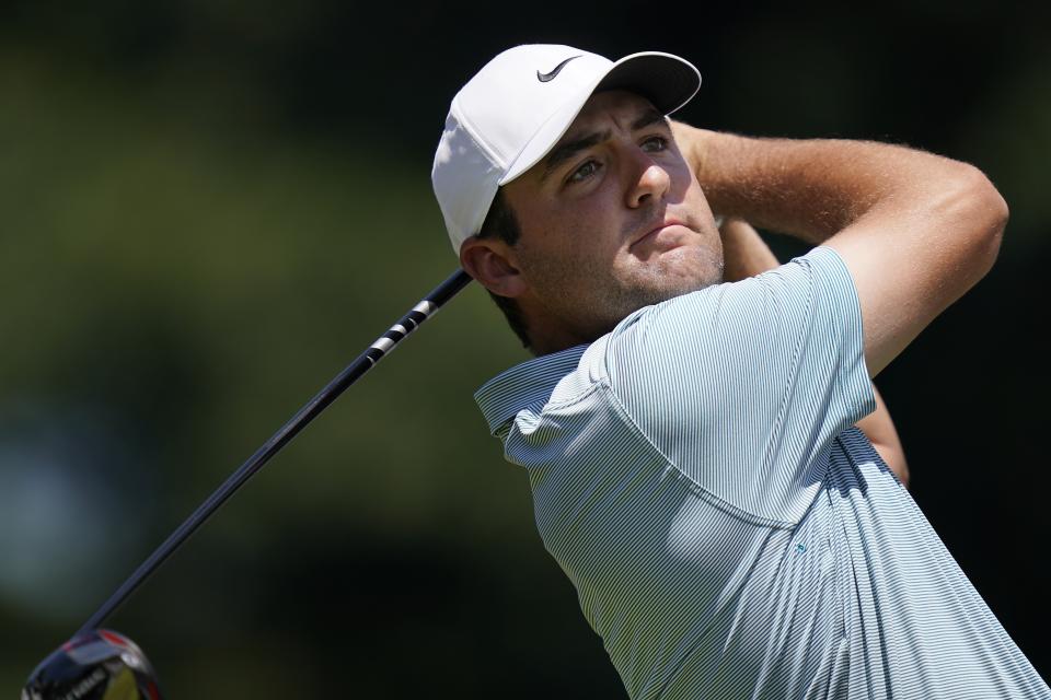 Scottie Scheffler tees off on the first hole during the final round of the Travelers Championship golf tournament at TPC River Highlands, Sunday, June 26, 2022, in Cromwell, Conn. (AP Photo/Seth Wenig)