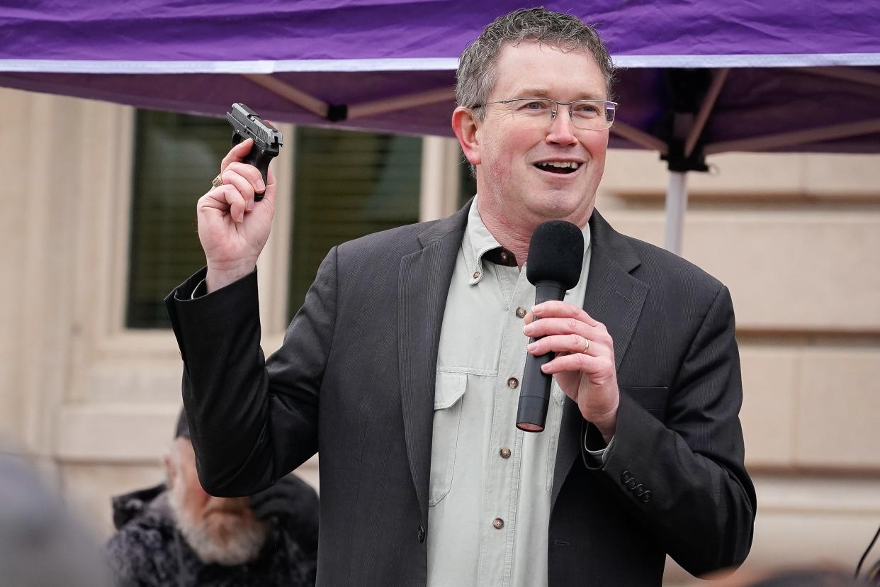 Rep Thomas Massie (R-KY) draws a Ruger LCP handgun from his pocket during a rally in support of the Second Amendment on 31 January, 2020 in Frankfort, Kentucky (Getty Images)