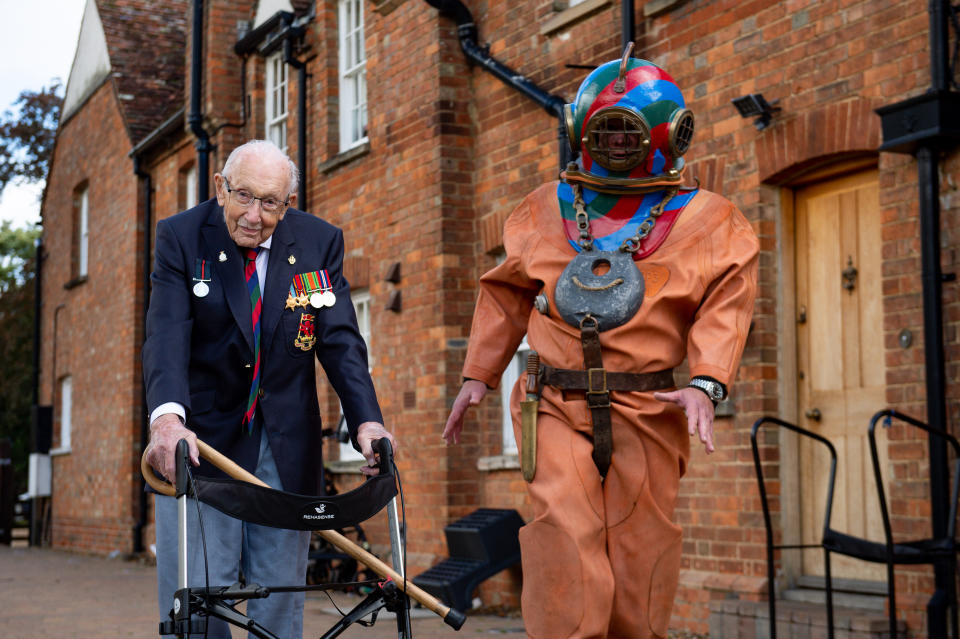 EMBARGOED TO 0001 FRIDAY SEPTEMBER 25 Captain Sir Tom Moore in Marston Moretaine, Bedford with veteran fundraiser Lloyd Scott, who will attempt to climb the Three Peaks whilst wearing a deep sea diving suit.