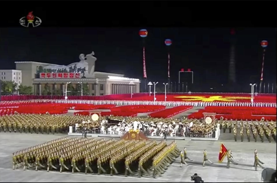 In this image made from video broadcasted by North Korea's KRT on Saturday, Oct. 10, 2020, military parade is held during a ceremony to celebrate the 75th anniversary of the country’s ruling party in Pyongyang.(KRT via AP)