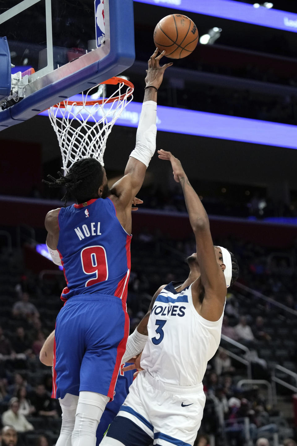 Detroit Pistons' Nerlens Noel (9) blocks a Minnesota Timberwolves forward Jaden McDaniels (3) shot in the second half of an NBA basketball game in Detroit, Wednesday, Jan. 11, 2023. (AP Photo/Paul Sancya)