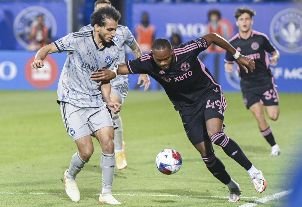 CF Montreal's Ahmed Hamdi, left, challenges Inter Miami's Shanyder Borgelin (49) during second-half MLS soccer match action in Montreal, Saturday, May 27, 2023. (Graham Hughes/The Canadian Press via AP)