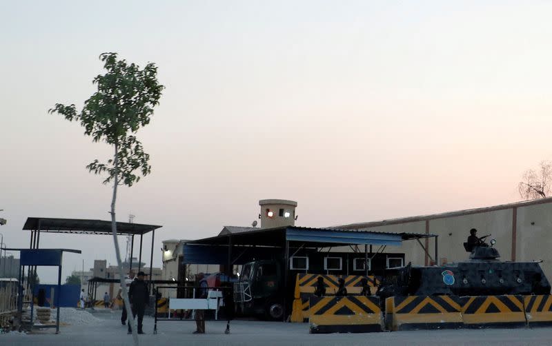 FILE PHOTO: Security and police vehicles guard Cairo's Tora prison, where the trial of ousted Egyptian Islamist President Mohamed Mursi took place, in Cairo