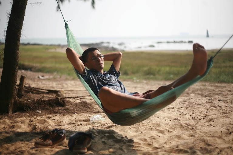 Lin Dong, founder of China's first association of private island owners, relaxes on his island off the coast of Guangxi