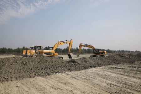 Excavators are seen in the Vashan Char, previously known as Thengar Char island in the Bay of Bengal, Bangladesh February 14, 2018. Picture taken February 14, 2018. REUTERS/Stringer