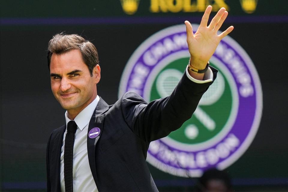 Roger Federer of Switzerland greets the audience during the Centre Court Centenary Celebration during day seven of The Championships Wimbledon 2022 at All England Lawn Tennis and Croquet Club on July 03, 2022 in London, England.