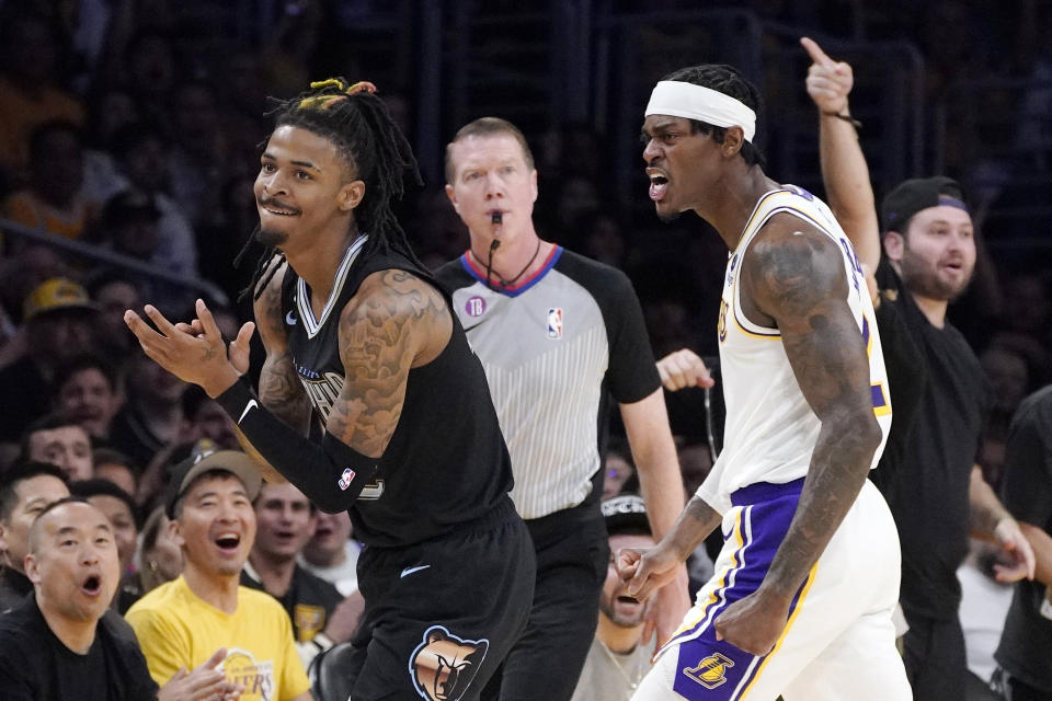 Memphis Grizzlies guard Ja Morant, left, and Los Angeles Lakers forward Jarred Vanderbilt, right, reacts after Morant lost the ball out of bounds during the first half in Game 3 of a first-round NBA basketball playoff series Saturday, April 22, 2023, in Los Angeles. (AP Photo/Mark J. Terrill)