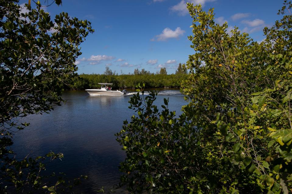 Boaters travel south along the adjacent canal to the empty lots of the area known as the Seven Island project Thursday, February 24, 2022. The city of Cape Coral is working with Forest Development Acquisition LLC to develop the long planned Seven Island project on a 47-acres property located along Old Burnt Store Road North. They are bringing a mixed-use development to northwest Cape Coral. 