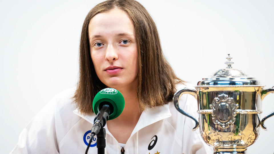 Iga Swiatek, pictured here speaking to reporters after her French Open victory.