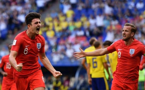 England's defender Harry Maguire (L) celebrates with England's forward Harry Kane after scoring the opener during the Russia 2018 World Cup quarter-final football match between Sweden and England at the Samara Arena in Samara on July 7, 2018. - Credit: afp