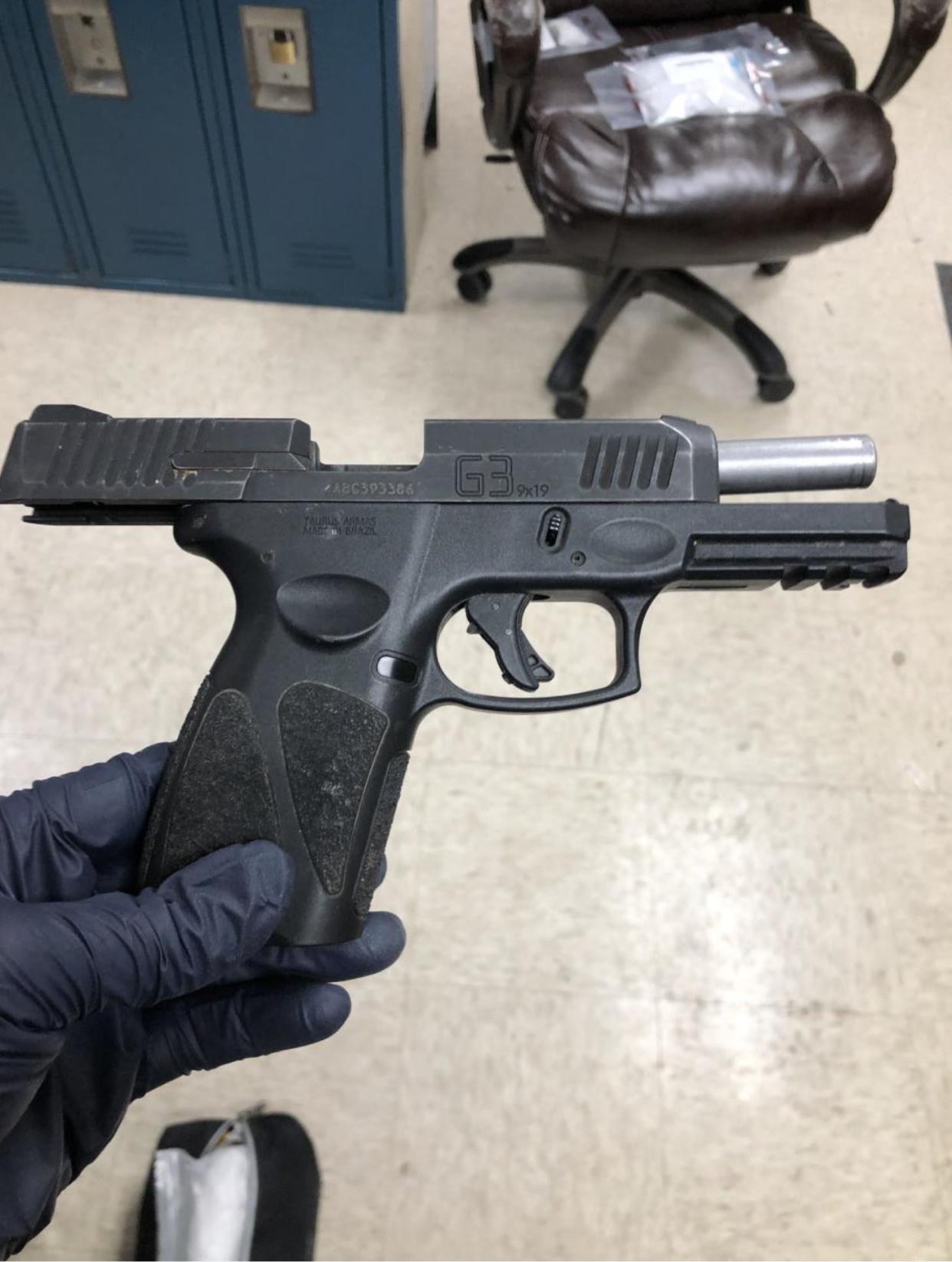 This was one of four handguns seized in a drug bust at a Lawrence convenience store in March.