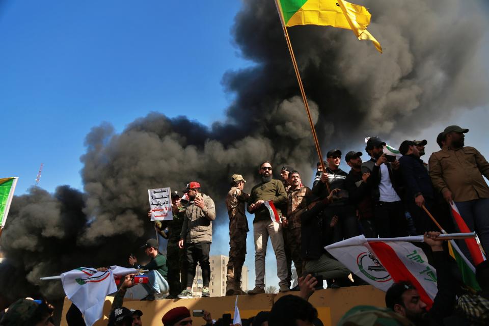 Protesters burn property in front of the U.S. embassy compound, in Baghdad, Iraq, Tuesday, Dec. 31, 2019. (Photo: Khalid Mohammed/AP)