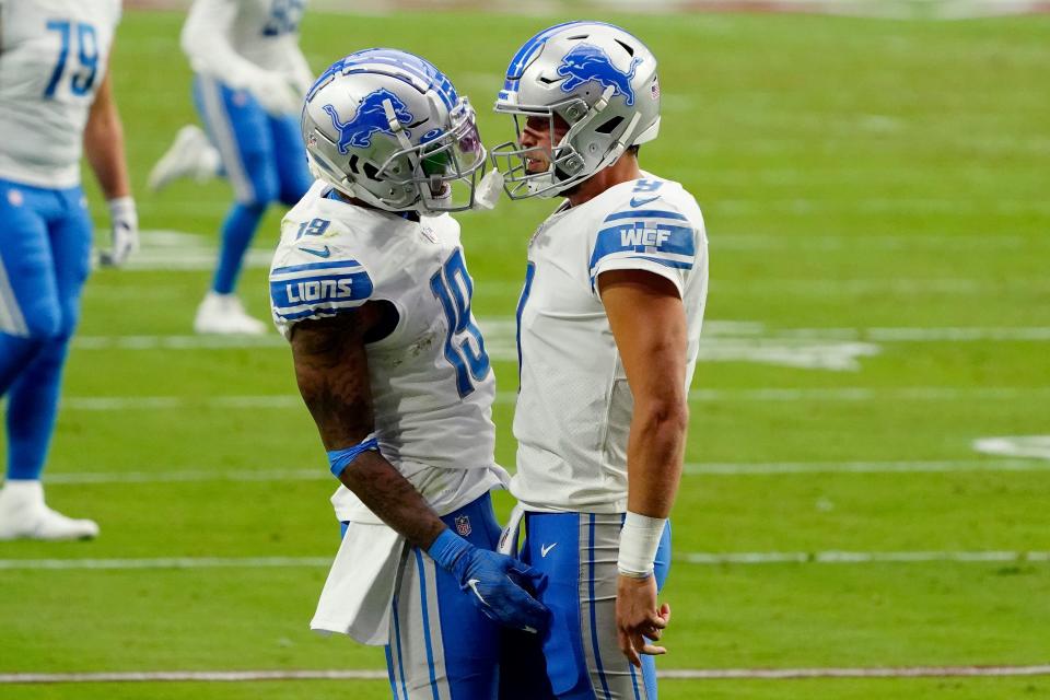 Lions wide receiver Kenny Golladay celebrate his touchdown catch with quarterback Matthew Stafford during the first half on Sunday, Sept. 27, 2020, in Glendale, Ariz.