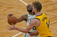 Boston Celtics guard Kemba Walker (8) reacts as he is fouled by Indiana Pacers forward Domantas Sabonis (11) in the fourth quarter of an NBA basketball game, Friday, Feb. 26, 2021, in Boston. (AP Photo/Elise Amendola)