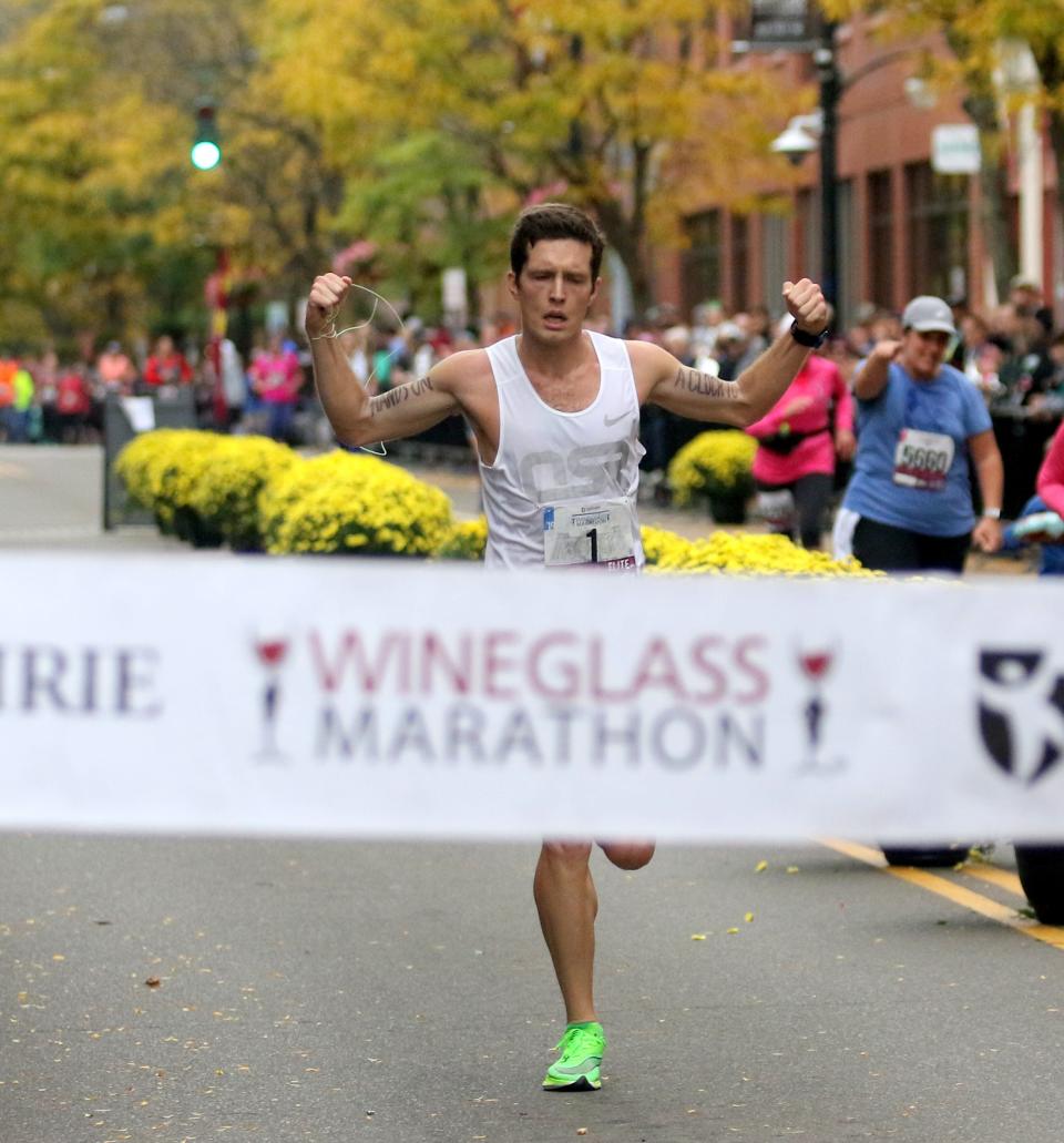 Alexander Burks of Geneseo finishes first in the men's race at the Wineglass Marathon on Oct. 6, 2019 in Corning. His time was 2:23:46.56.