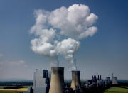 Steam rises from the coal-fired power plant in Neurath, Germany, Thursday, June 8, 2023. The United Nations Climate Change Conference, takes place in the German city of Bonn from June 5 until June 15 to prepare the COP28 climate summit in Dubai. (AP Photo/Michael Probst)