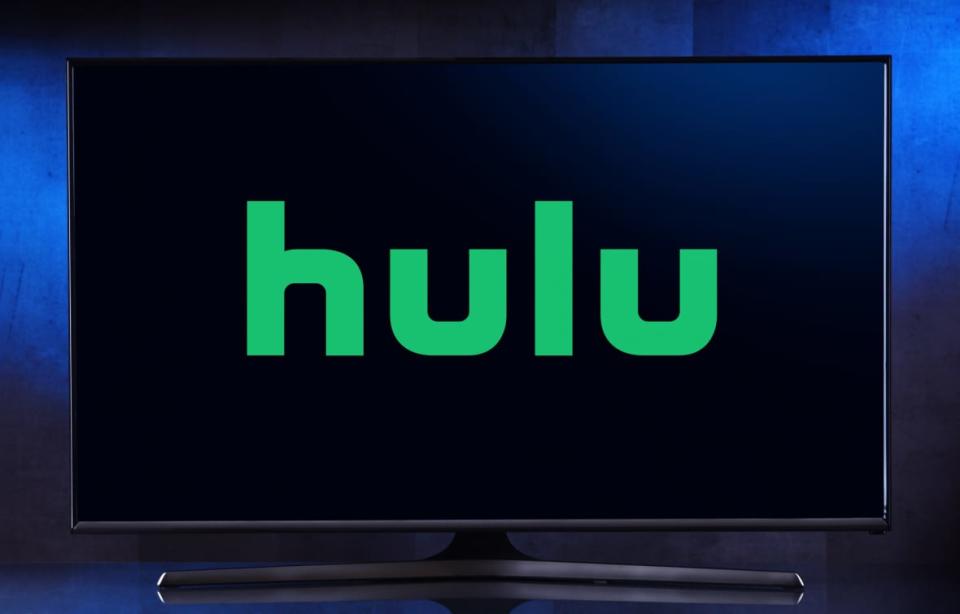 A Flat-screen TV set displaying a Hulu logo. (Adobe Stock)