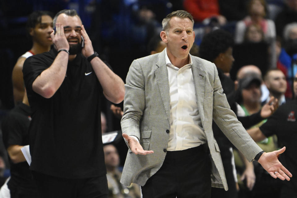 Alabama coach Nate Oats and assistant coach Bryan Hodgson react during the first half of an NCAA college basketball game against Texas A&M in the finals of the Southeastern Conference Tournament, Sunday, March 12, 2023, in Nashville, Tenn. (AP Photo/John Amis)
