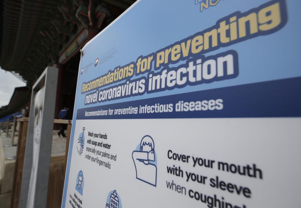 A banner showing precautions against the coronavirus is seen at the Gyeongbok Palace, one of South Korea's well-known landmarks, in Seoul, South Korea, Sunday, Aug. 16, 2020. South Korea has reported 279 new coronavirus cases in the highest daily jump since early March, as fears grow about a massive outbreak in the greater capital region.(AP Photo/Lee Jin-man)