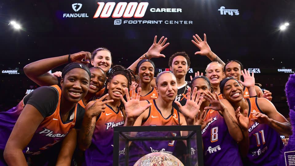 Phoenix Mercury players celebrate Taurasi's 10,000th WNBA point in August. - Kate Frese/NBAE/Getty Images
