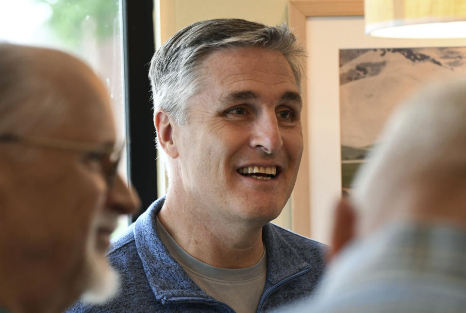 In this Saturday, Oct. 6, 2018 photo, George Scott, the Democratic candidate for Congress in a Republican-leaning seat in conservative central Pennsylvania, listens to volunteer canvassers while meeting with them, in Camp Hill, Pa. A court-ordered redrawing of Pennsylvania's House districts has forced several Republican congressmen into more competitive seats and helped establish Pennsylvania as a key state for Democrats aiming to recapture the House majority. (AP Photo/Marc Levy)